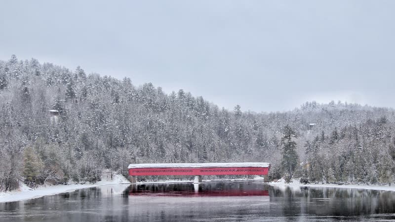 A winter walk through a Red Covered Bridge