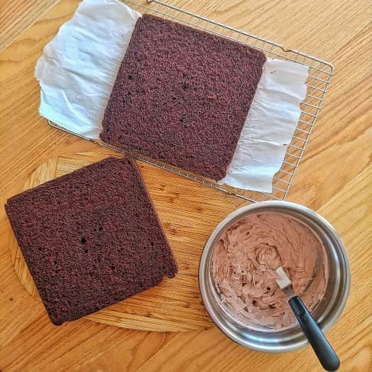 Chocolate cake on the table ready to be frosted.