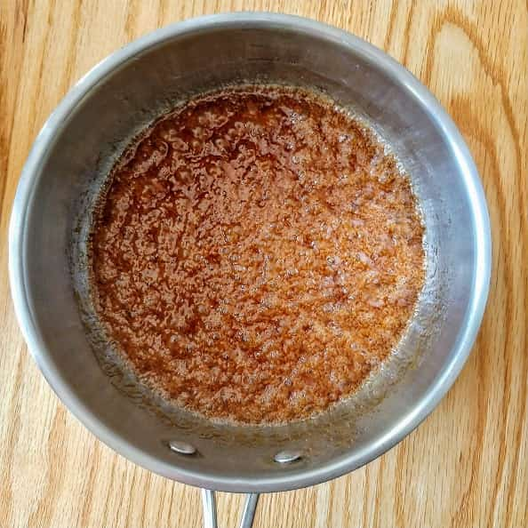 Saucepan with Brown sugar and Vegan butter being melted.