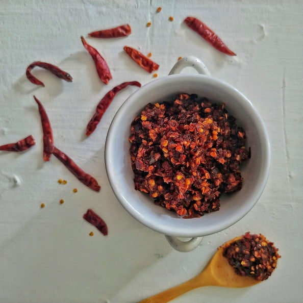 Sri Lankan Shrimp Chili Paste on display with the scooped out spoon of chili paste.