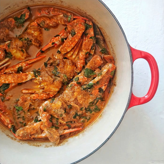 Jaffna crab curry in a Red Le Creuset Dutch oven.