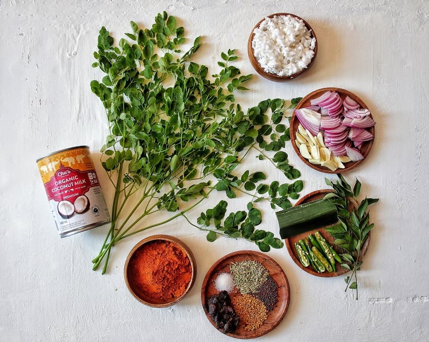 Ingredients for the crab curry. Moringa leaves, Coconut milk, spices, jaffna curry powder.