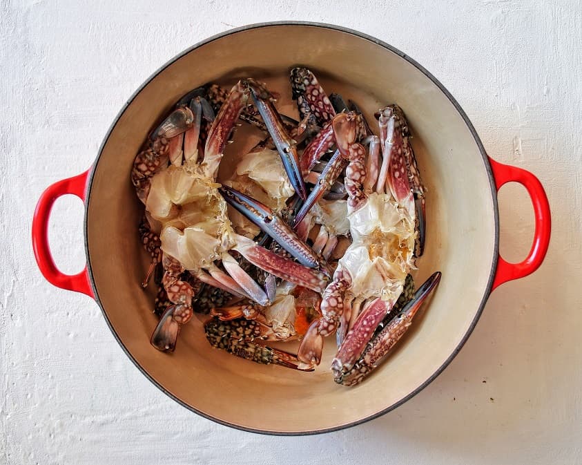 Cleaned and trimmed Blue swimmer crab inside a Le Creuset pot ready for cooking.