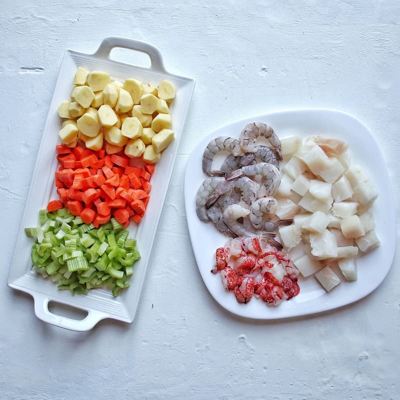 Ingredients for seafood chowder- Lobster tails, Cod Loin, Shrimp, Carrots, Potatoes, Celery.