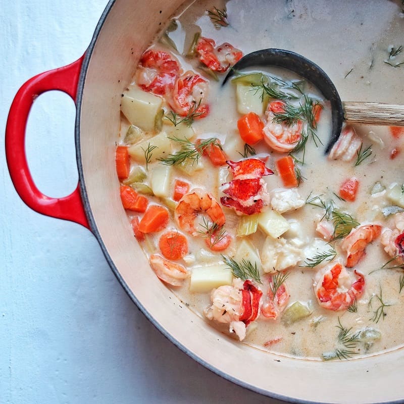 Dairy free seafood chowder in a pot.