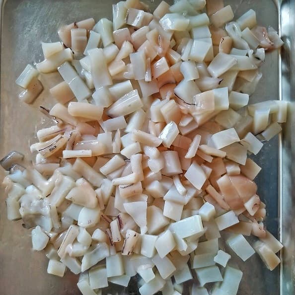 Squid cleaned and diced ready for cooking,